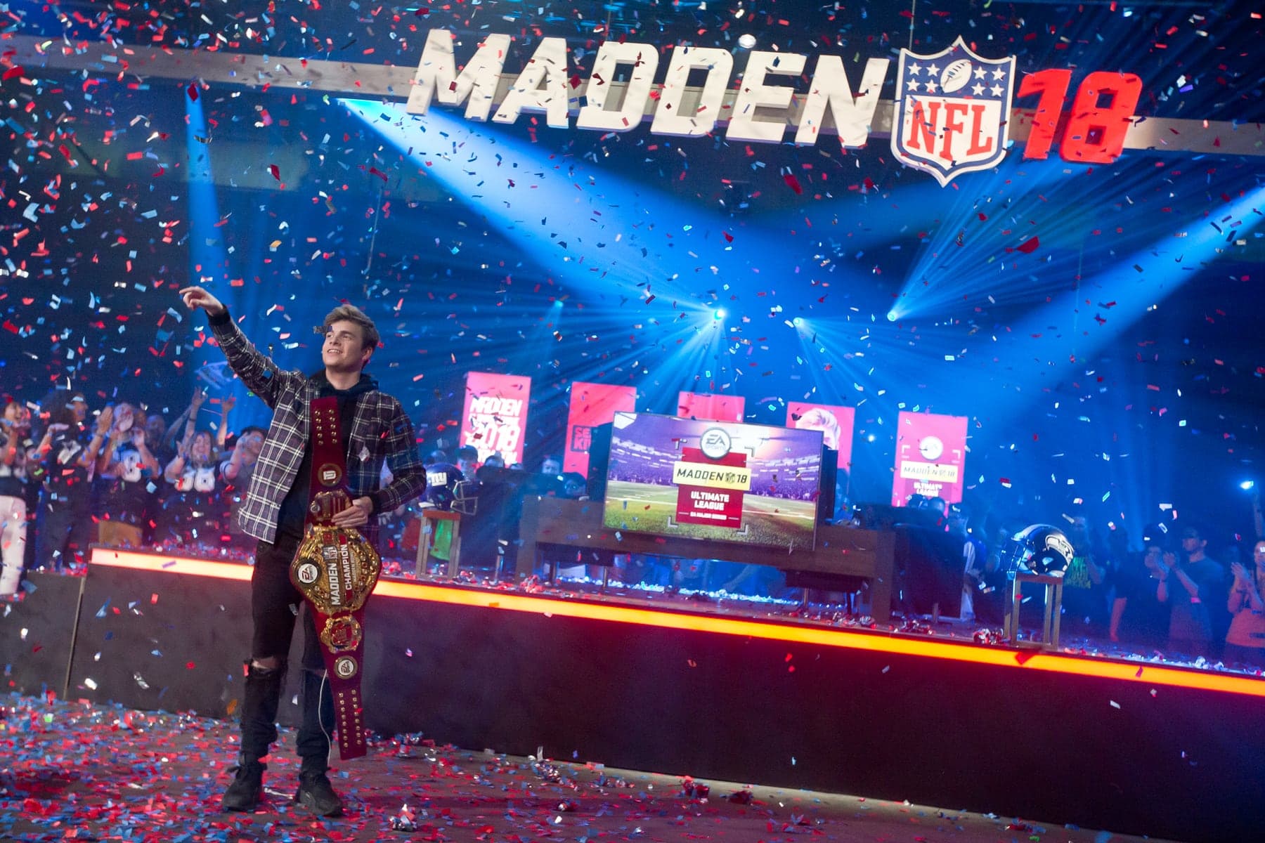 Kiv celebrating his Madden championship on stage.